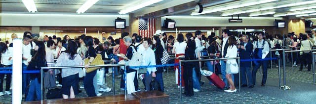 people walking through an airport